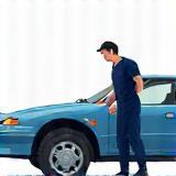 Illustration of an expert technician working on a car at Spotless Auto Spa